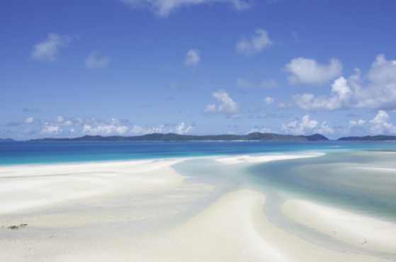a view of a beach next to a body of water